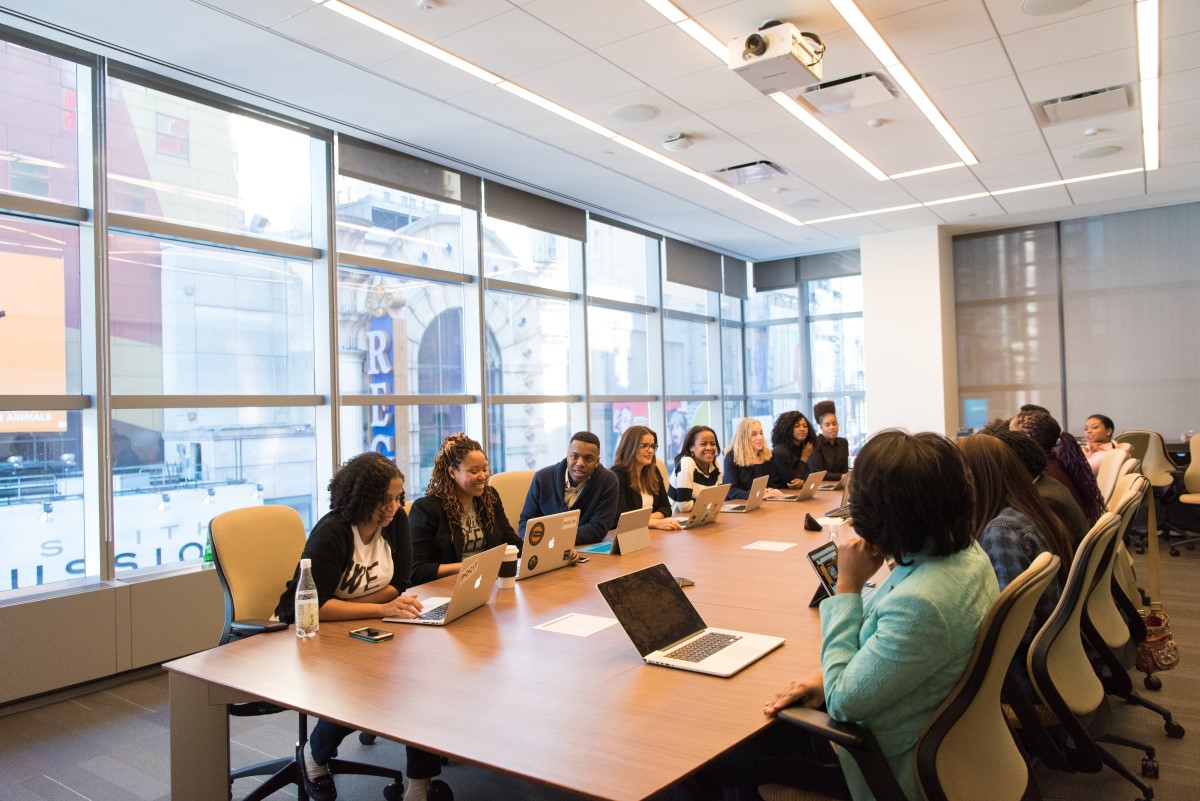 diverse boardroom executives around a table